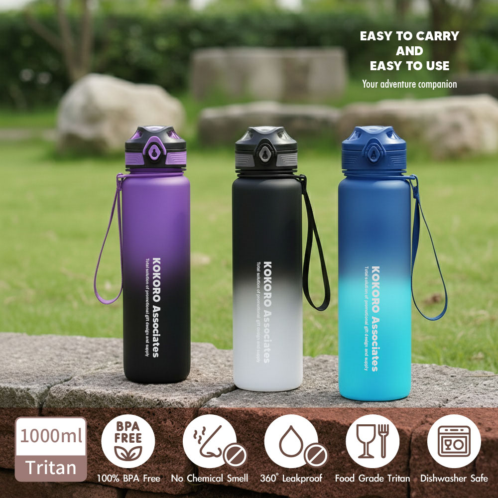 Three gradient bottles on a stone wall outdoors