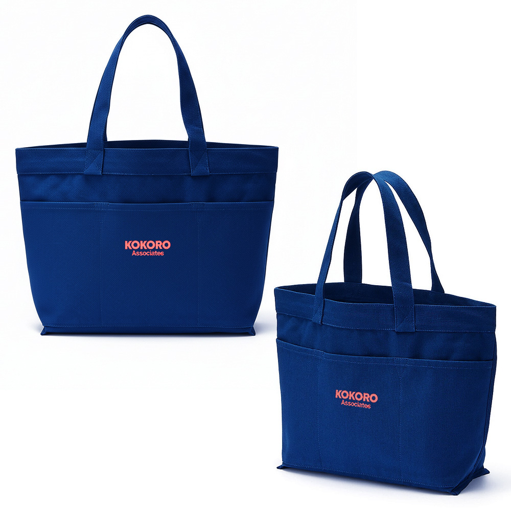 Navy canvas carry tote with front pockets and Kokoro Associates branding